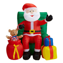 Uppblåsbar props, tomte i fotölj med julklappar 122 cm